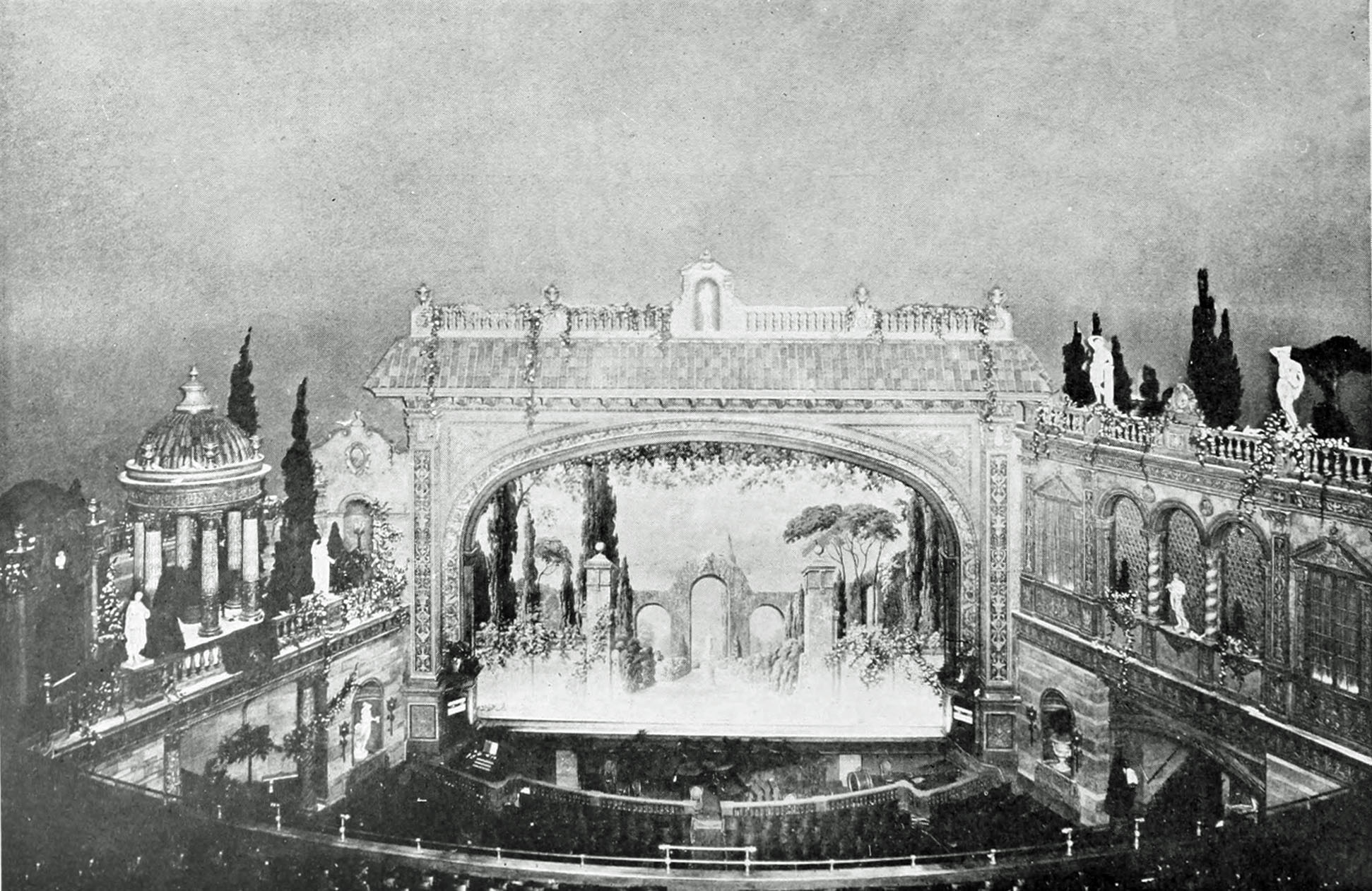 Full view of stage, side walls and ceiling of the Riviera Theatre, Detroit. The proscenium is a tile-covered triumphal arch.