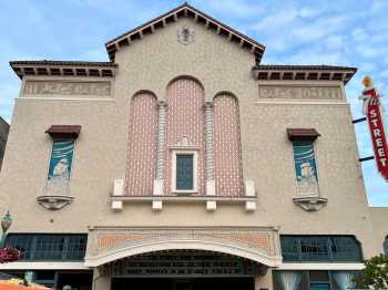 Façade in late June 2025 following repainting of the sgraffito sailing ship murals and central triple alcoves, courtesy <i>7th St Theatre</i> (JPG)