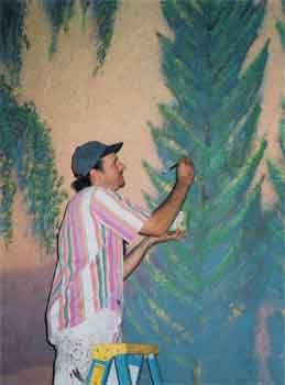 Artist Patrick Barszcz repaints the sidewall murals in 1999, photo courtesy John Slaven (JPG)