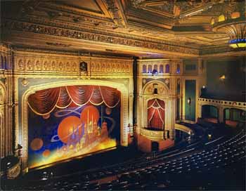 The riotous fire curtain depicting a futuristic fantasy city surrounded by planets and comet trails, from <i>“The Last Remaining Seats”</i> by Robert Berger & Anne Conser (JPG)